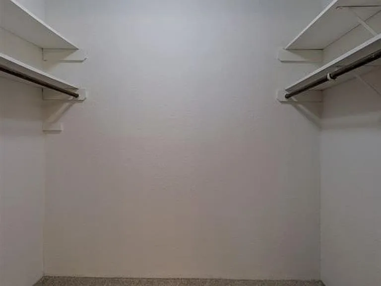 Large walk-in closet in a unit at Whispering Isle.