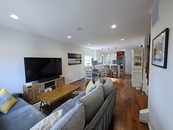 Step in to the open plan floor living, dining, and kitchen experience.