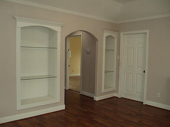 The living room also  features two  built-in cabinets.