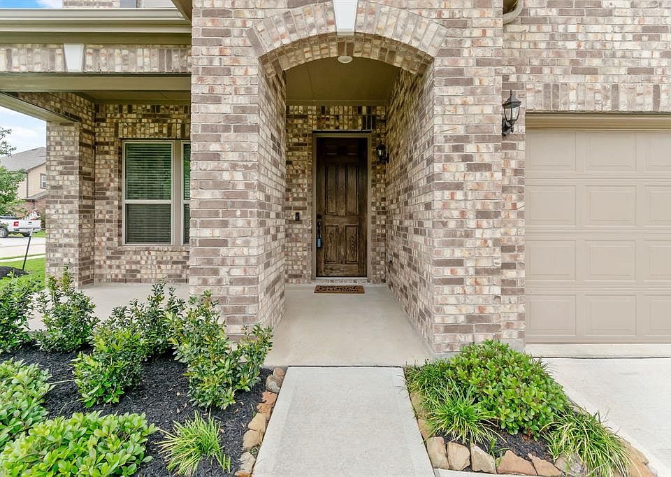 The brick compliments the over sized front door