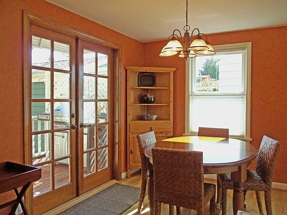 Enjoy garden views from this cheerful dining room. French doors open to the deck and easy access for grilling year round. In warmer weather dine alfresco with the doors open!