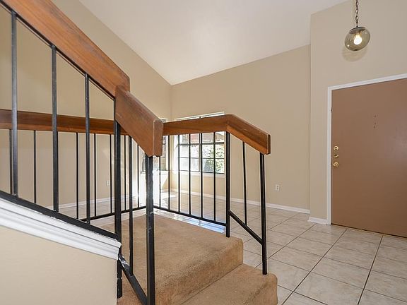 Lovely iron and wood staircase leads to 3 nice size bedrooms