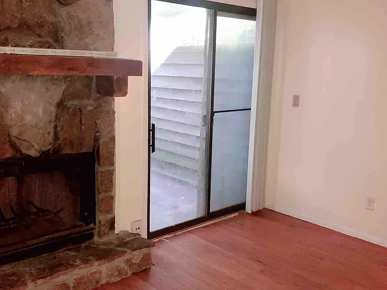Living Room with Fire Place and Sliding doors to fenced back patio
