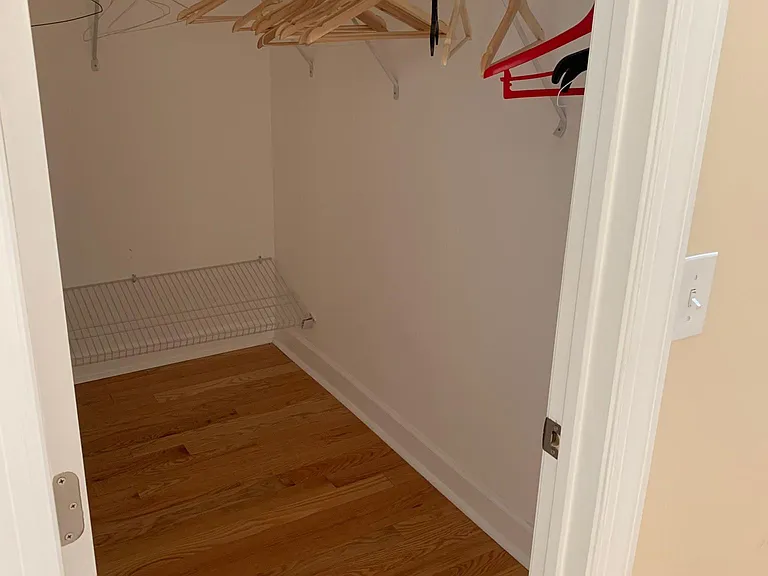 Primary bedroom walk in closet