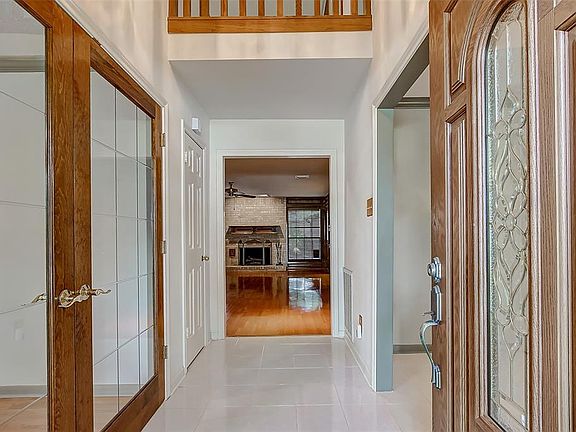 The front door opens up to a large foyer with the study to the left and the dining room to the right.