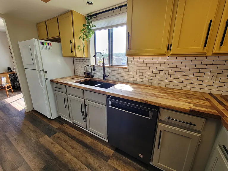 Deep Granite Sink and Butcher Block counters