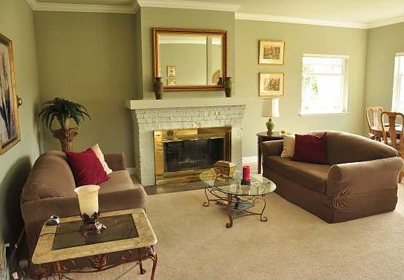 The beautiful original brick fireplace is the focal point in the living area