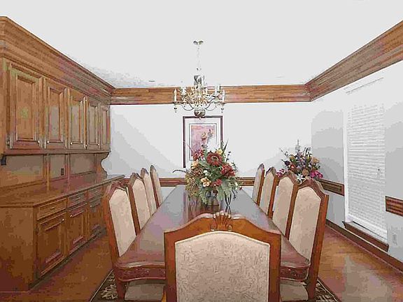 Elegant formal dining room with built in buffet and room for the whole family to enjoy.