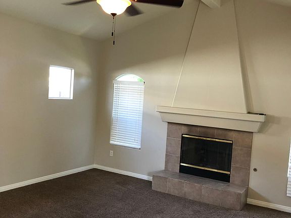 Gas burning (logs) fireplace. Ceiling fans throughout