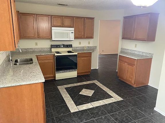 Better picture taken without refrigerator. Rental includes refrigerator and appliances.