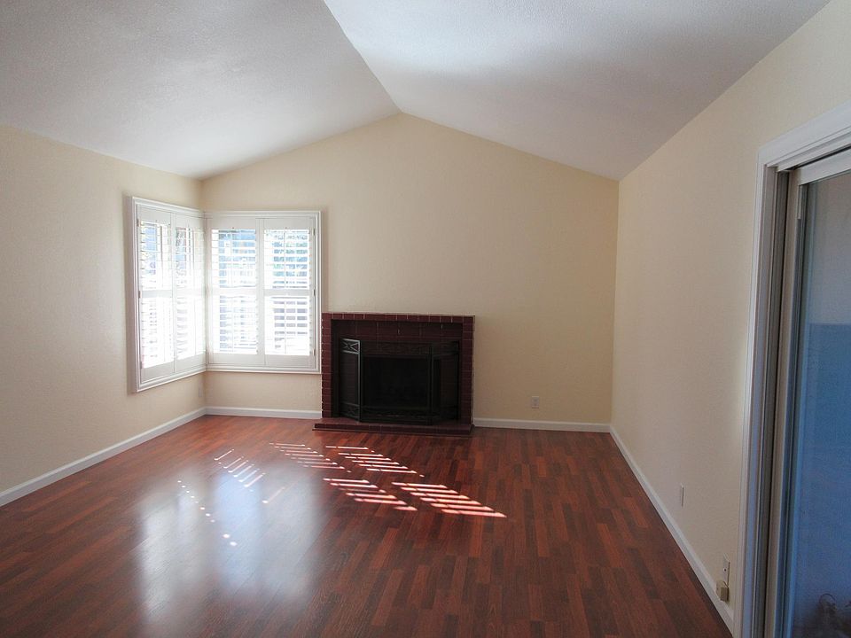 Living room with fire place and vaulted ceilings