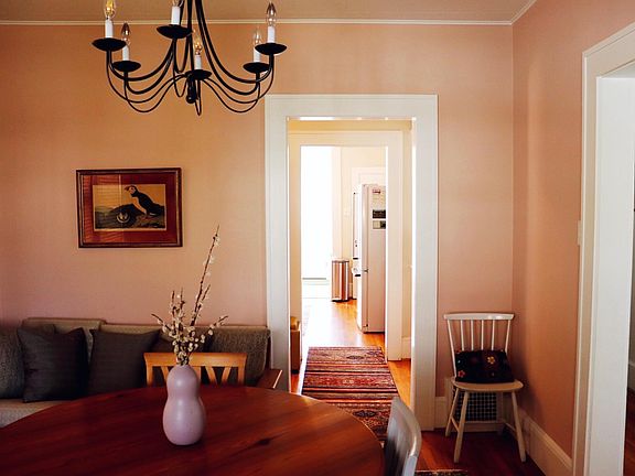 Dining room view through butler_s pantry to kitchen.