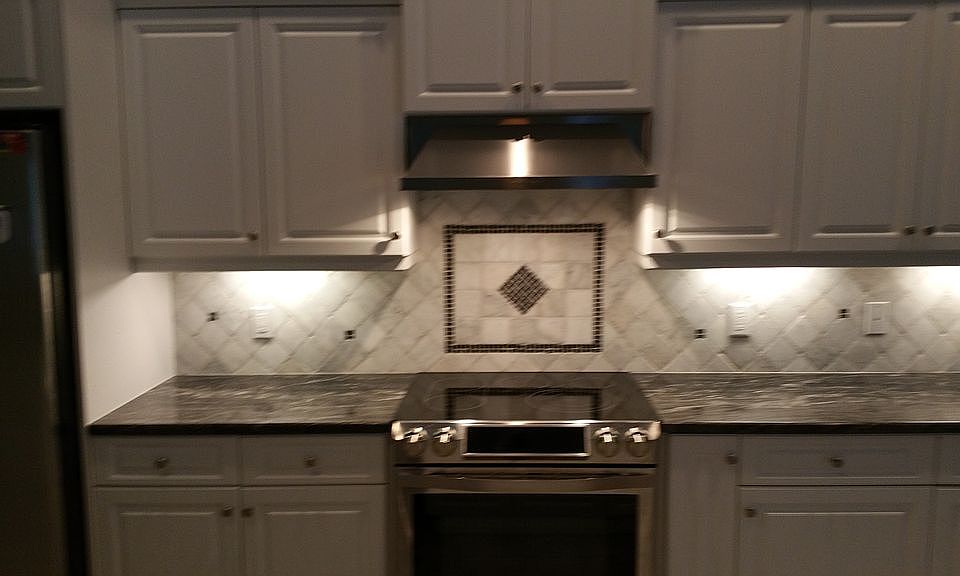stove area with tile back sp
