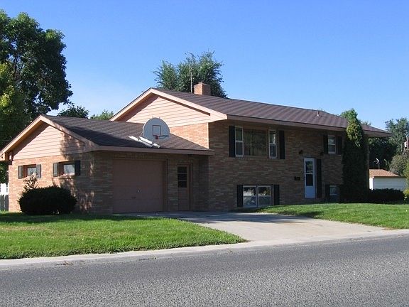 Split level house with single car garage.