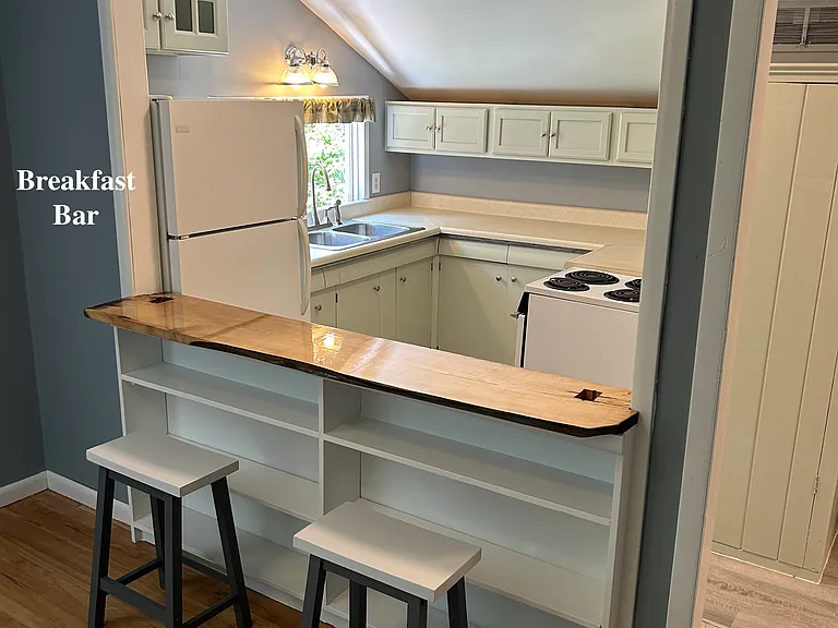 Breakfast bar - with built in shelf, with a reclaimed countertop with electric outlet and phone charger