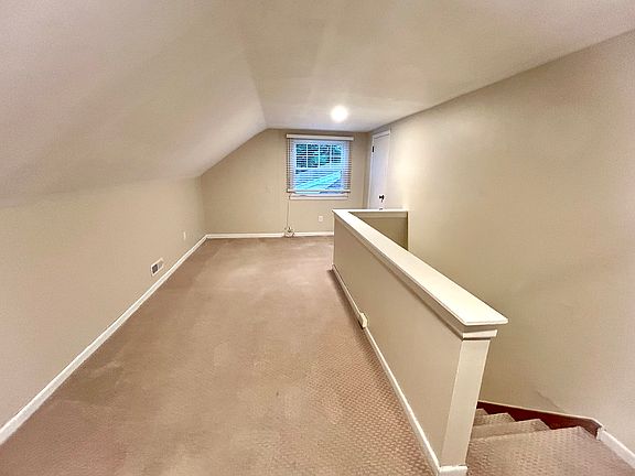 Half of living room from top of stairs.