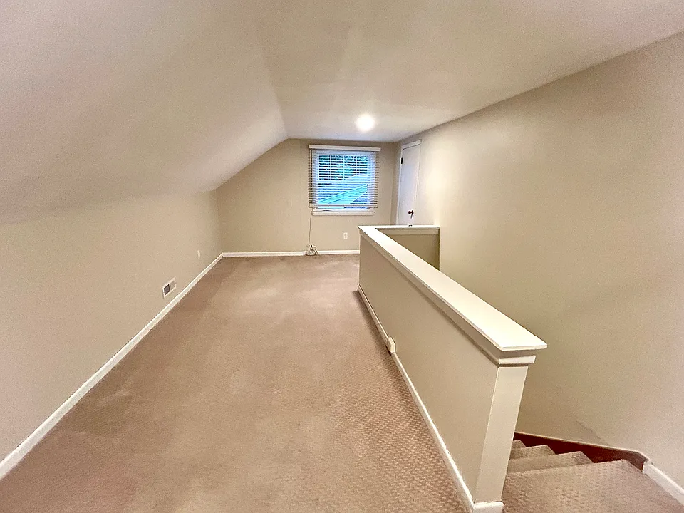 Half of living room from top of stairs.