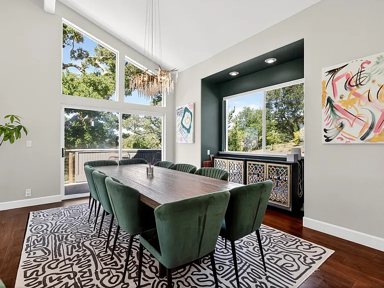 Dining room. Window overlooks driveway, slider leads to deck