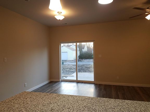 Dining/Living room area with sliding doors to poured patio