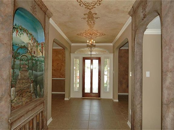 Grand entry with custom painted ceiling and mural