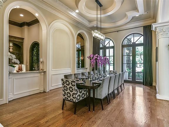 The formal dining room easily offers seating from 10 to 25 guests. The open space expands nicely and has direct access to the bar and large temperature controlled wine room. The bar with beverage cooler serves the dining room from beautiful granite servin