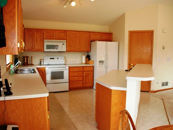 Cabinets galore, open kitchen/dining