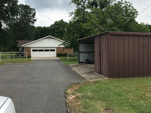 Carport with store room 