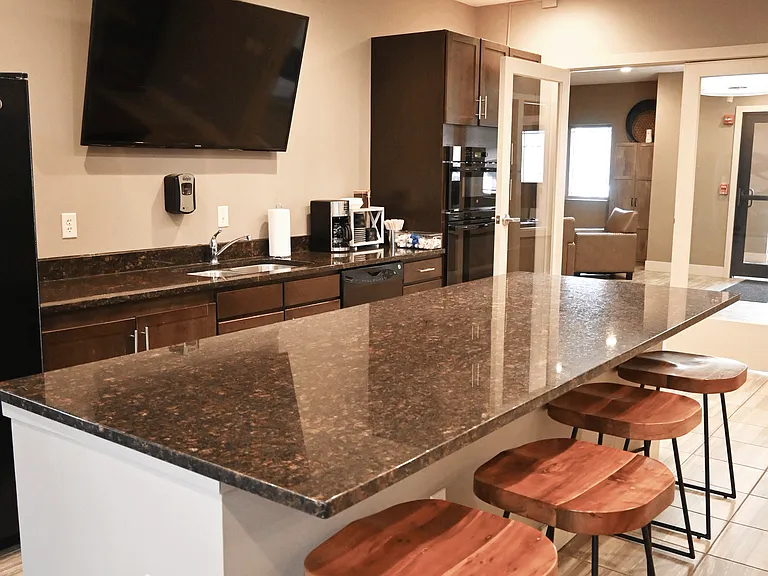 Modern community kitchen located in the clubhouse at The Sterling Kearney.