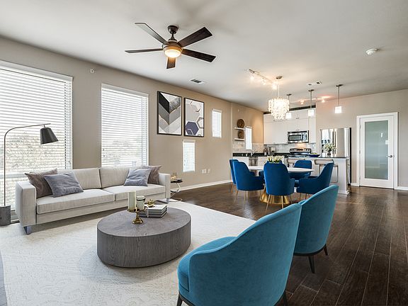 Another virtual view of main living areas open to the kitchen