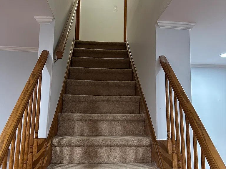staircase to second floor. masterbedroom to the left