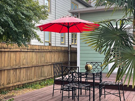 Private backyard with tiered deck.