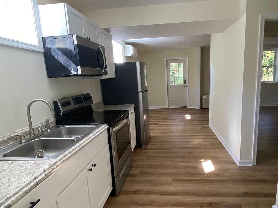 Kitchen opens to living room and private entrance.