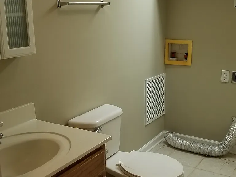 HALF BATH AND LAUNDRY ON GROUND FLOOR