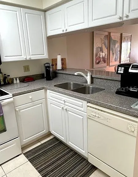 Kitchen and Breakfast Bar Over Looking Living and Dining Areas