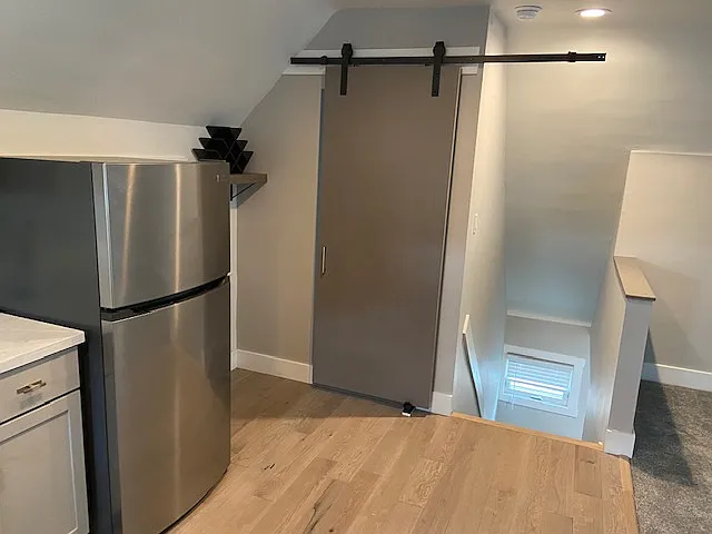 Up Into Kitchen. Barn door to closet