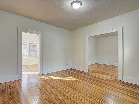 Newly remodeled with refinished hardwood floors and fresh paint