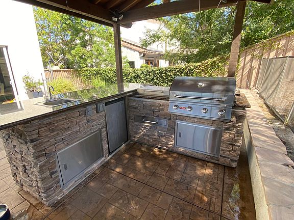 BBQ area with tile roof.