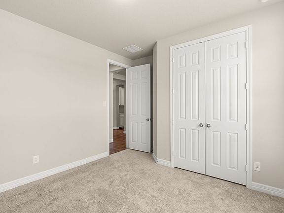 An additional view of the fourth bedroom and closet.