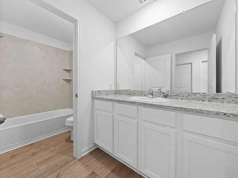 Spacious full bathroom located upstairs.