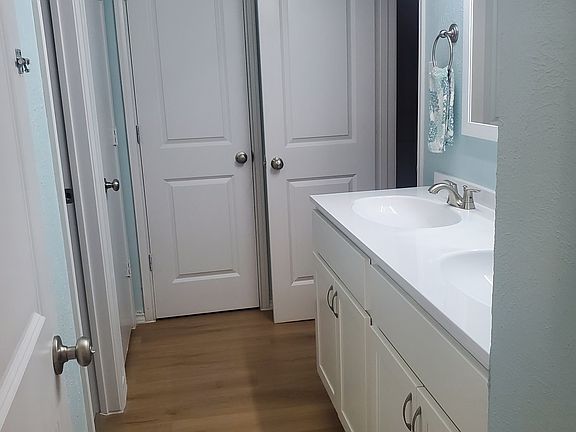 Upstairs j-n-j vanity area with closet.