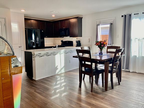 Open floor plan with appliances, gas stove, lots of natural light..