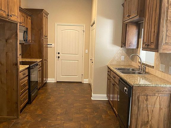Kitchen with door to garage