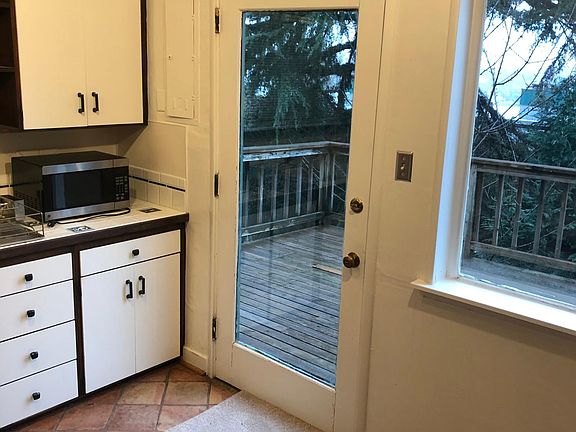 Door from kitchen to large view deck