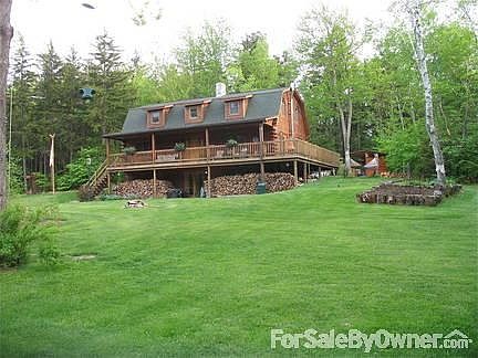 THE HOUSE
						:
						The front has a covered porch, which wraps around to the back and a screened-in