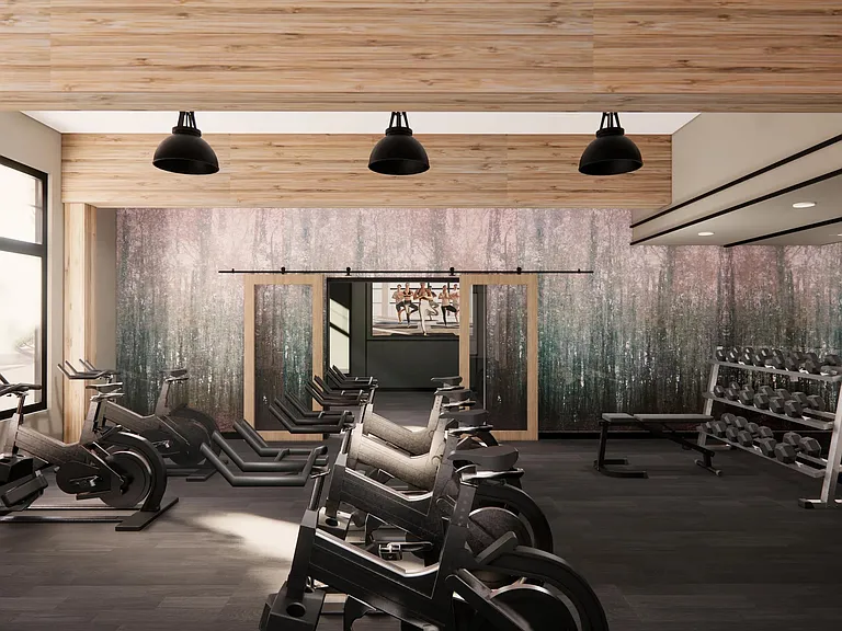 The fitness center at Modera Bridle Trails offers modern equipment and a welcoming setting for energizing workouts.