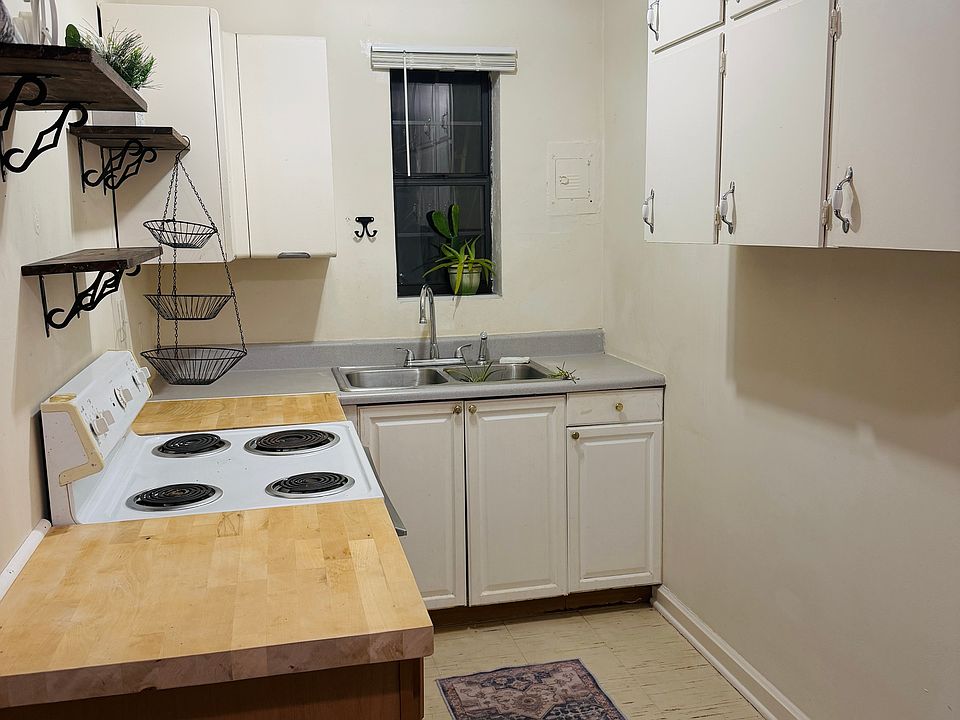 Cute and compact kitchen with ample storage space