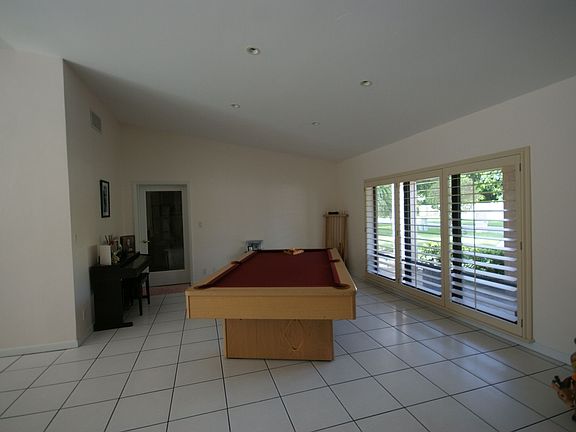 Family room with floor to ceiling windows