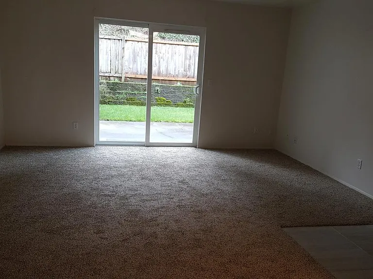 Living room w/patio and yard
