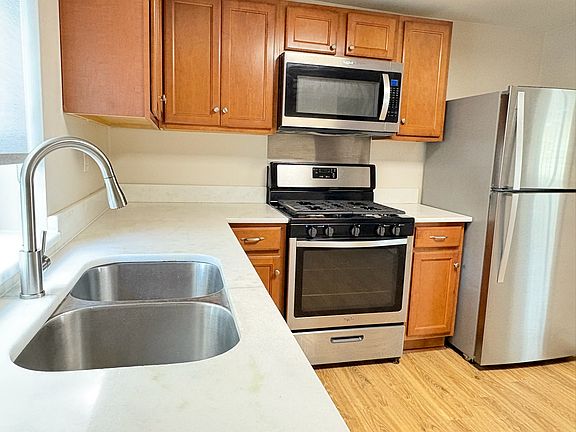 Deep undermount stainless sink with brand new pull-down faucet.