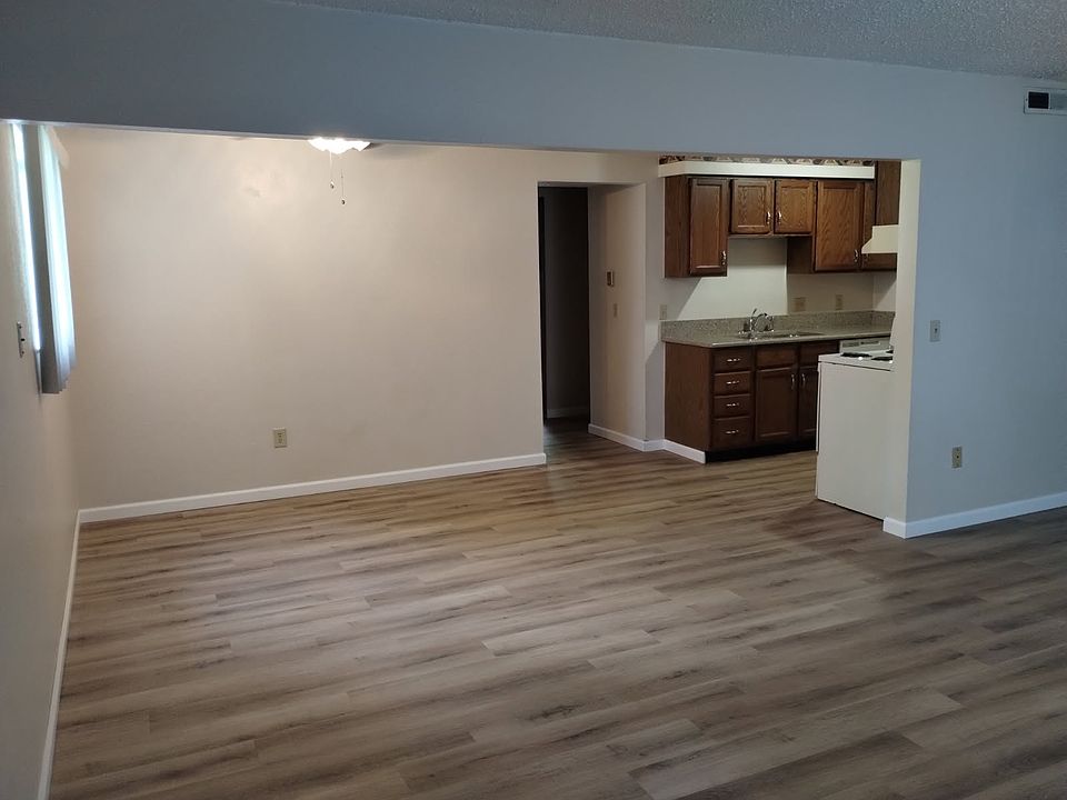 NEWLY PAINTED & NEW FLOORING IN THE LIVING ROOM & DINING AREA